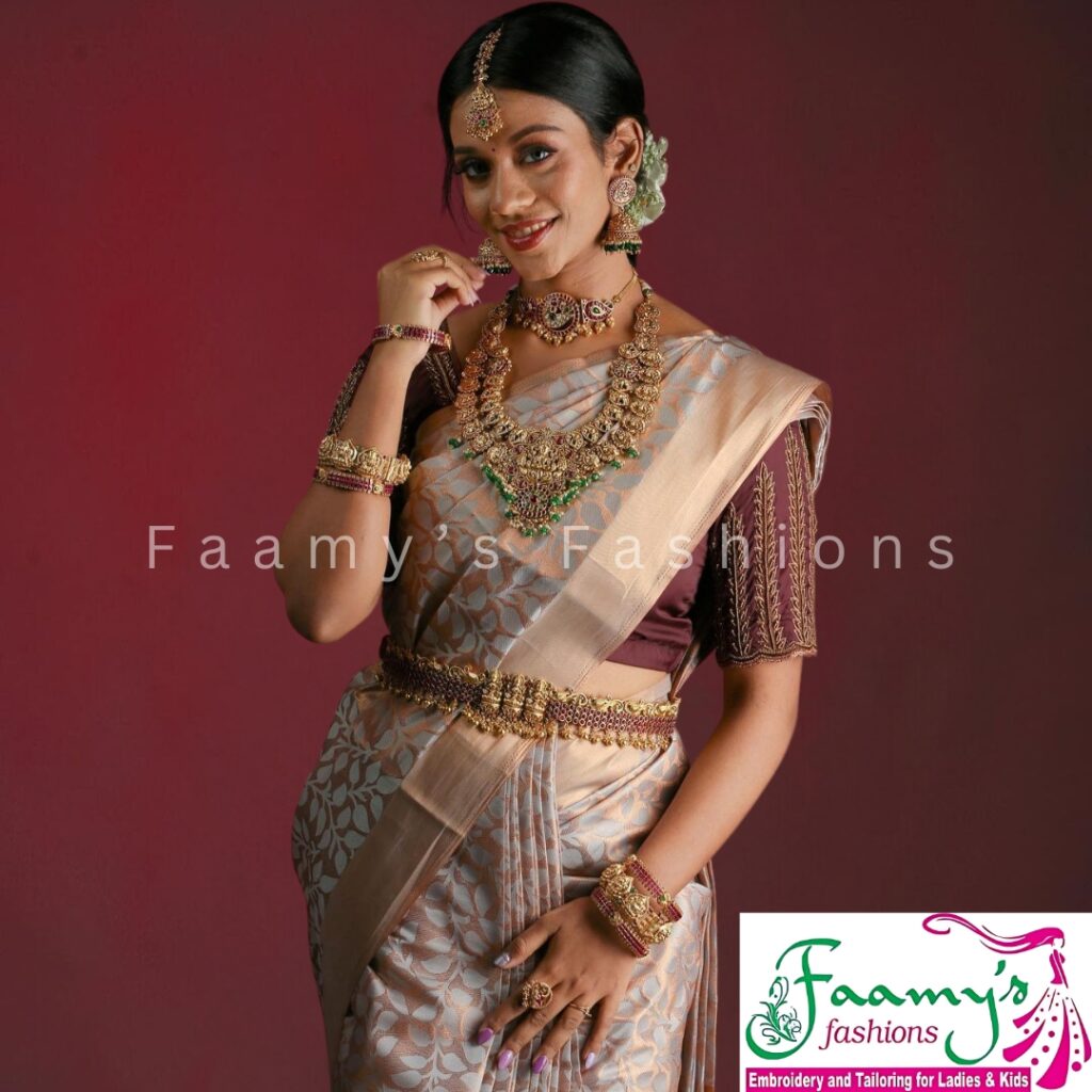 Bride in custom bridal blouse with aari work and silk saree, styled by Faamy’s Fashions – experts in bridal tailoring and embroidery for ladies.