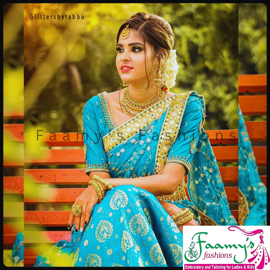 Woman in traditional Indian attire posing for Faamy’s Fashions advertisement.